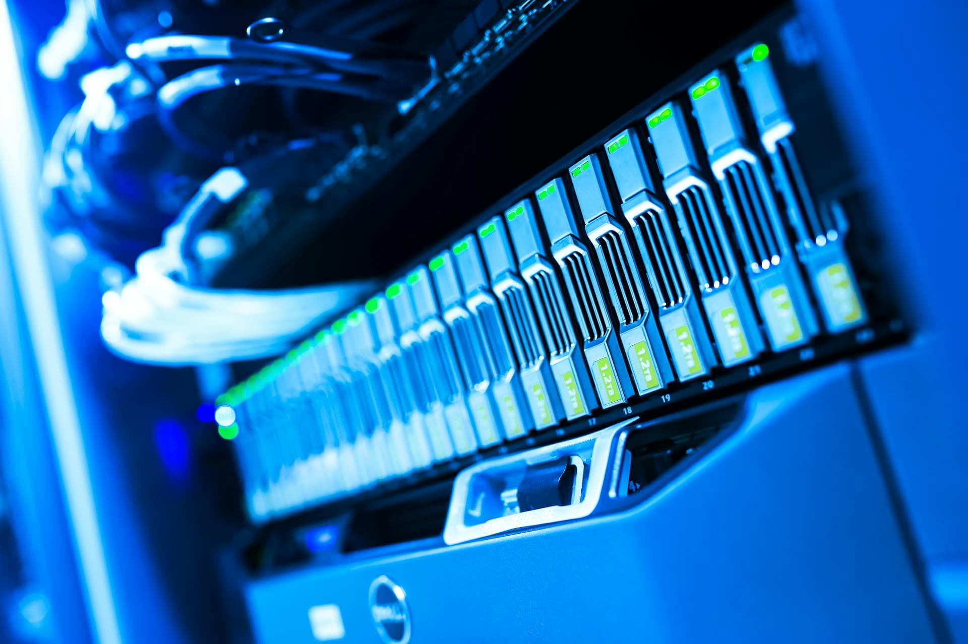 Blue-lit server rack in a dim data centre — evoking the older on-premise hardware quietly approaching the Windows Server end-of-support cliff.